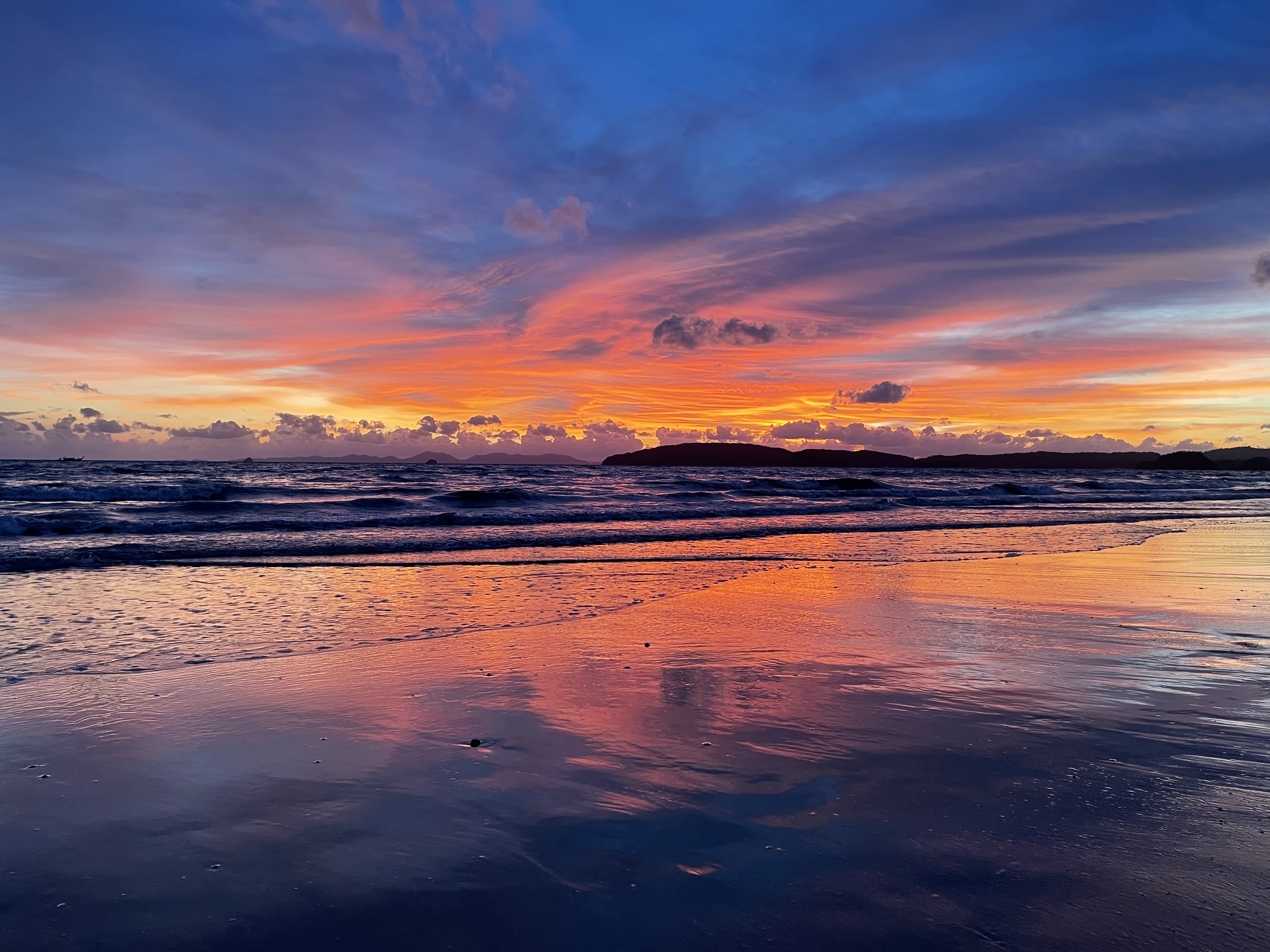 Sunset on the beach in Ao Nang, Thailand. Purples, oranges, and blues.