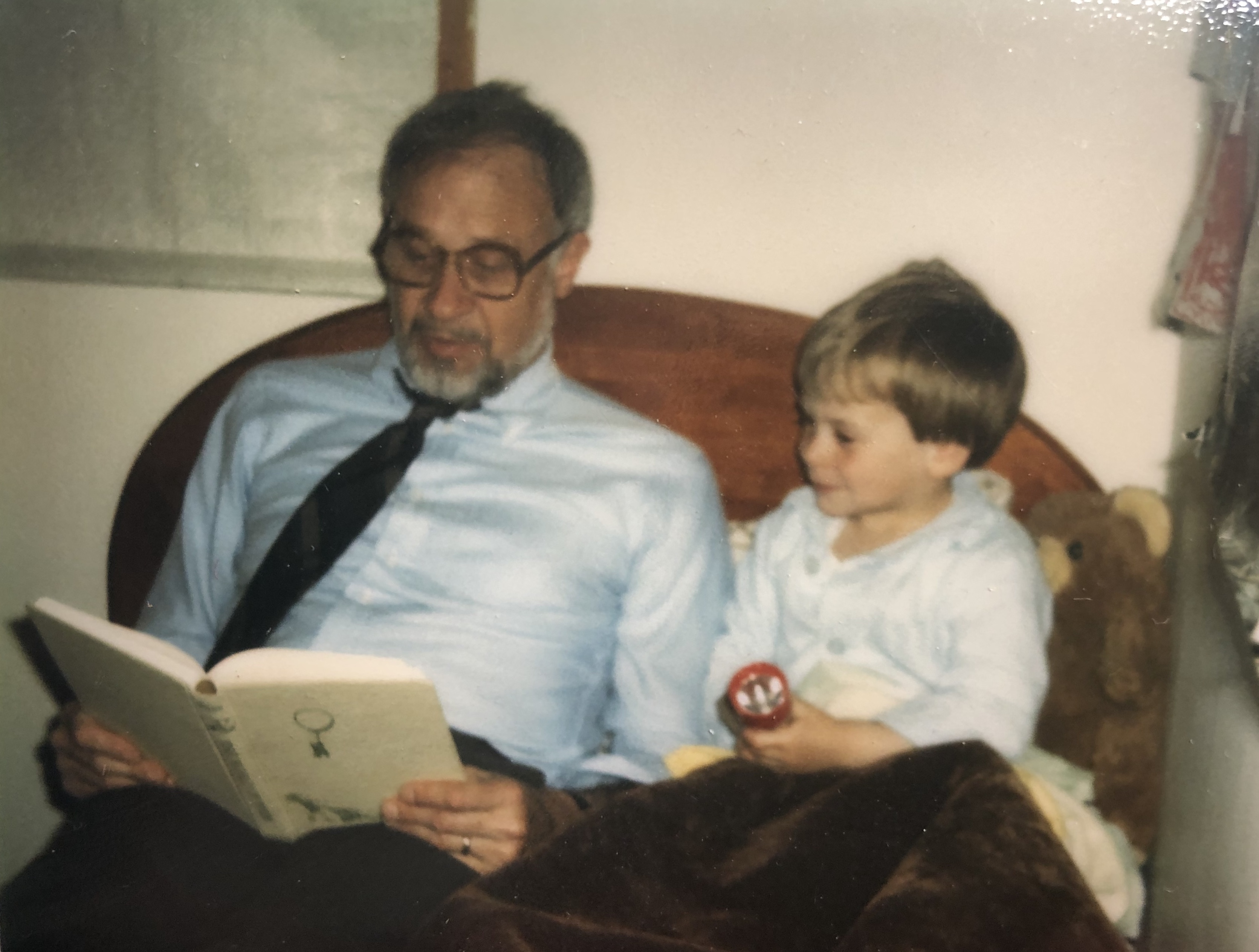 My grandfather, Keith Seegmiller, reading to me when I was small