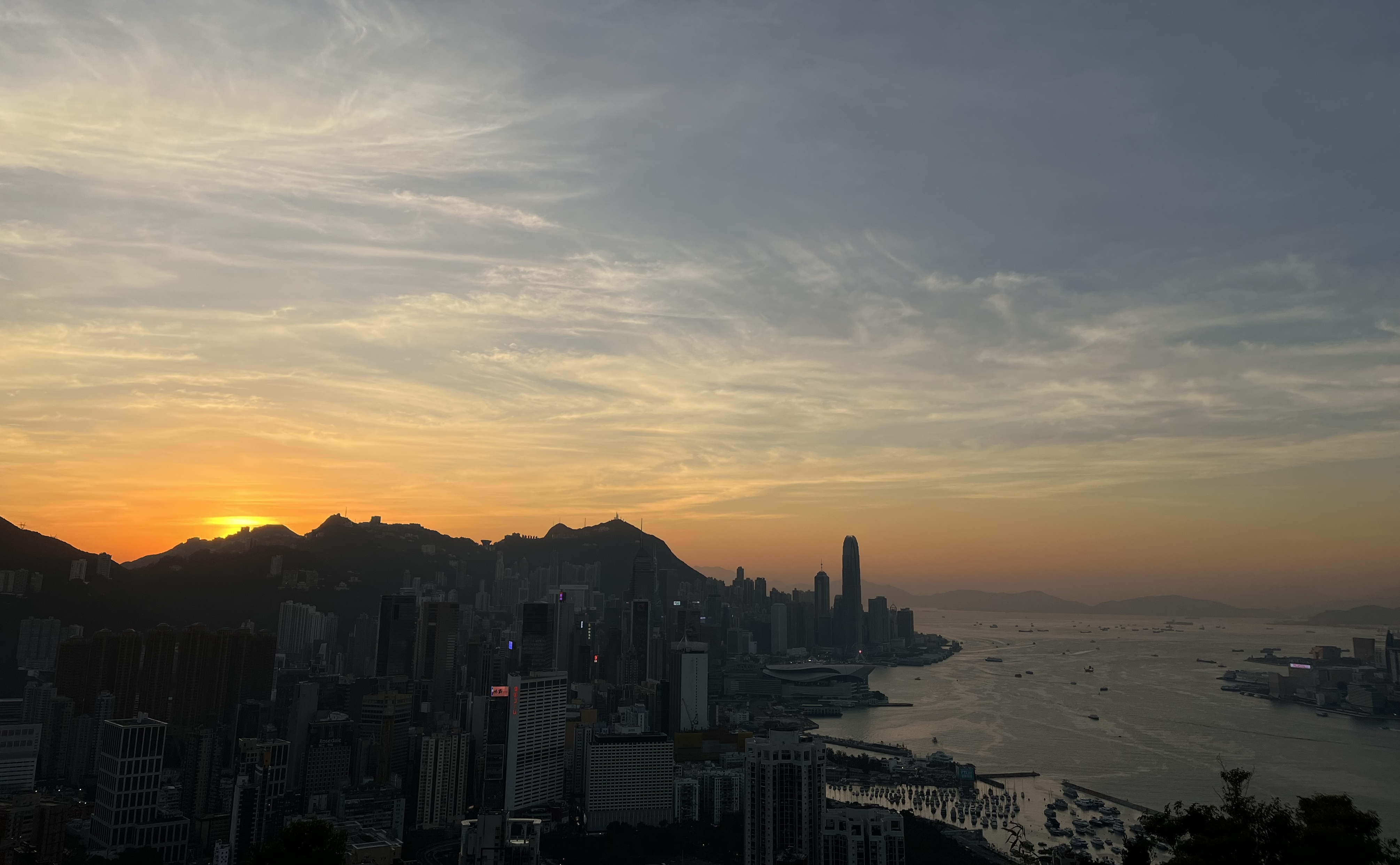 The sun sets over Hong Kong